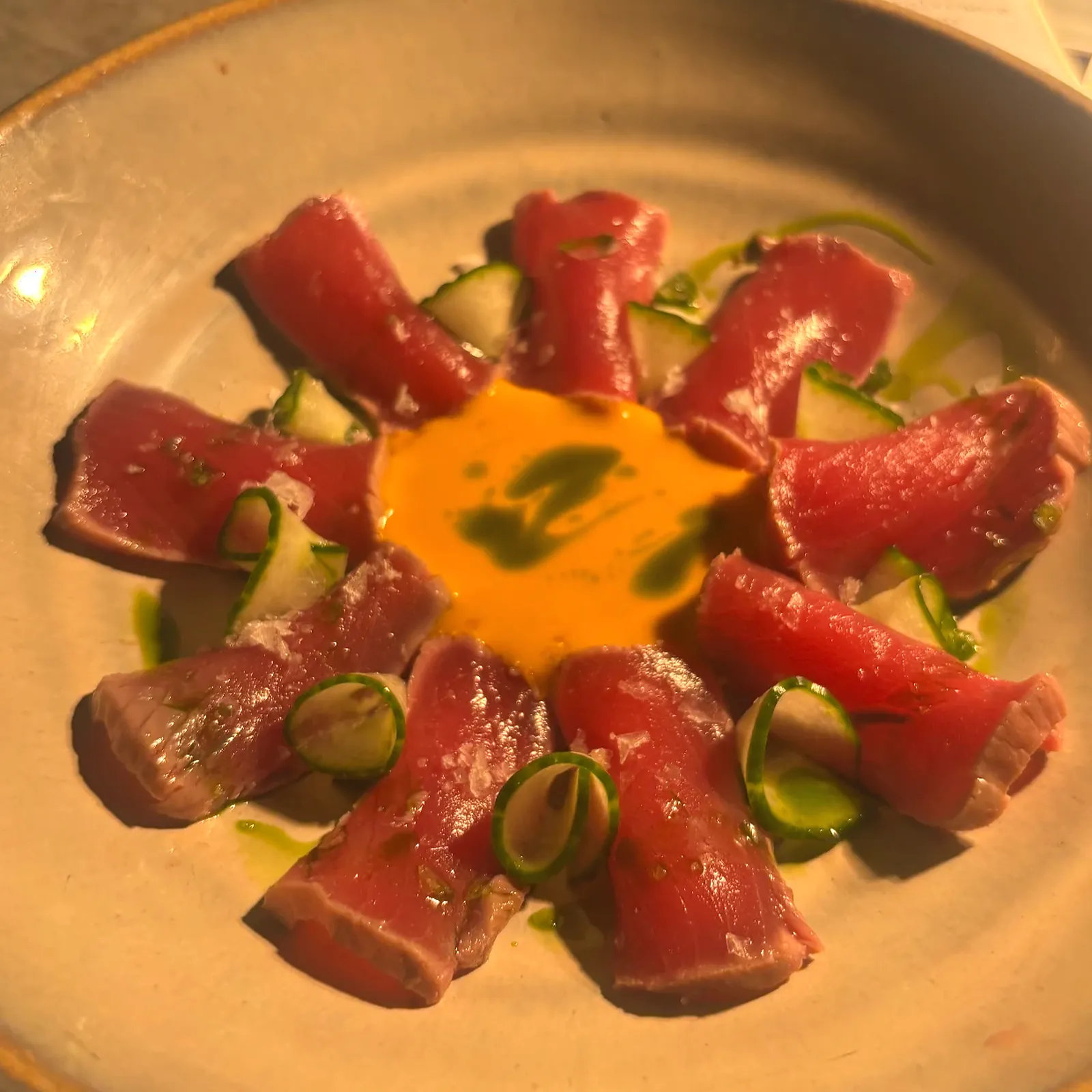 Tuna crudo with citrus cream, cucumber and herb oil